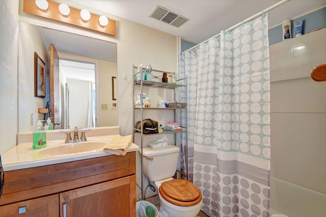 full bathroom with vanity, shower / bath combination with curtain, and toilet