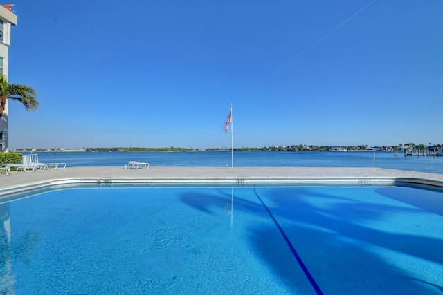 view of pool with a water view