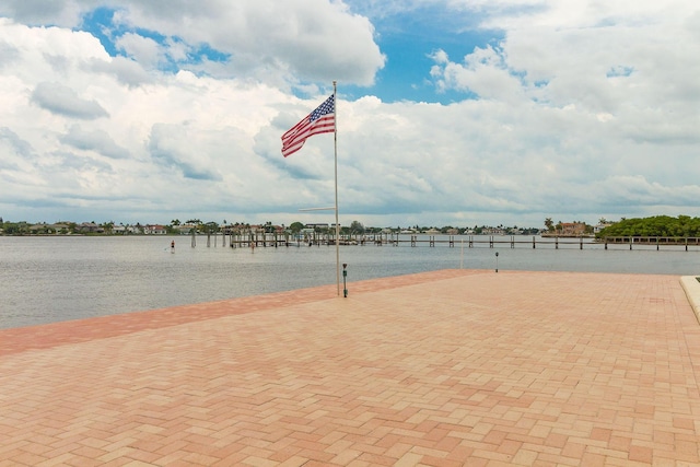 view of sport court featuring a water view