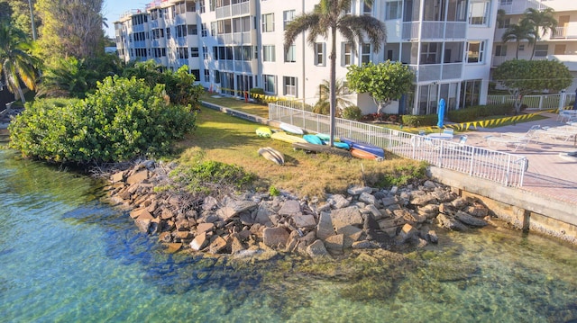 view of community with a water view