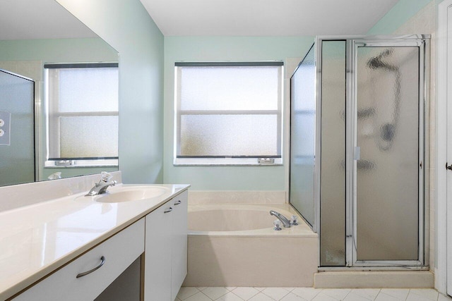 bathroom with a wealth of natural light, tile patterned flooring, and shower with separate bathtub