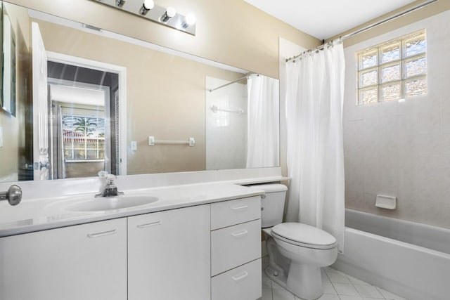 full bathroom featuring plenty of natural light, vanity, shower / bath combination with curtain, and tile patterned flooring