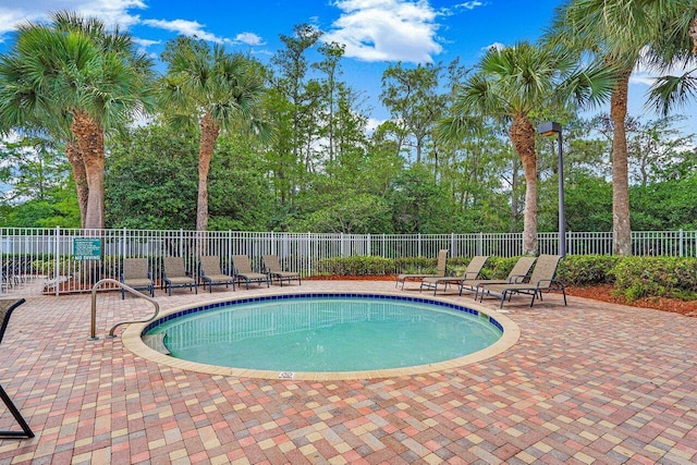 view of swimming pool featuring a patio area