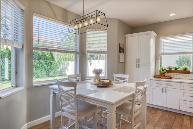 dining space featuring light wood-type flooring