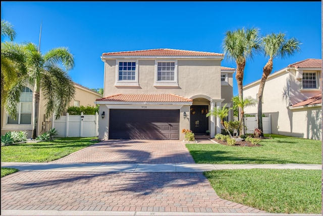 mediterranean / spanish-style house with a front yard and a garage