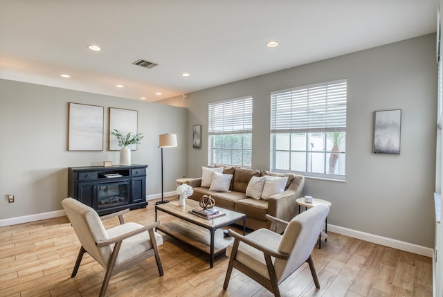 living room with light hardwood / wood-style floors