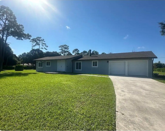 ranch-style home with a front lawn and a garage