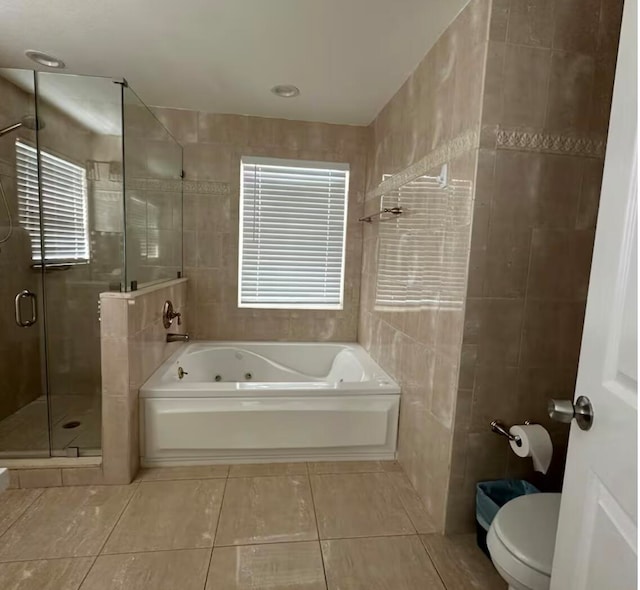 bathroom featuring separate shower and tub, tile patterned flooring, tile walls, and toilet