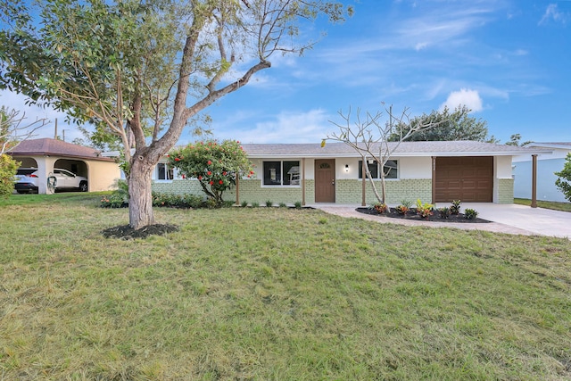 ranch-style house featuring a garage and a front lawn