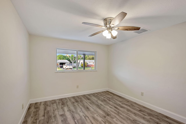 unfurnished room featuring ceiling fan and light hardwood / wood-style flooring