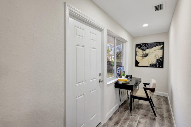 doorway featuring light hardwood / wood-style floors