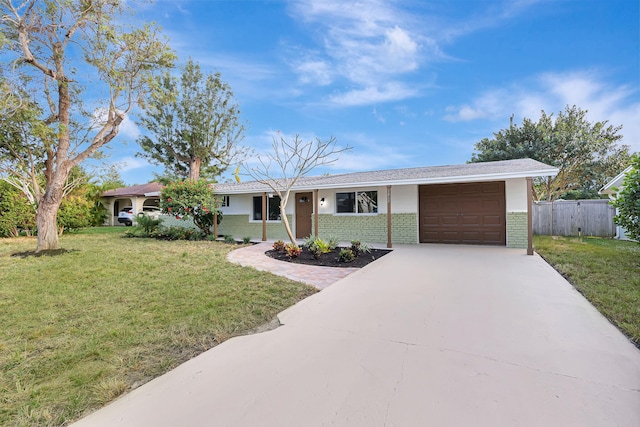 ranch-style house with a front yard and a garage