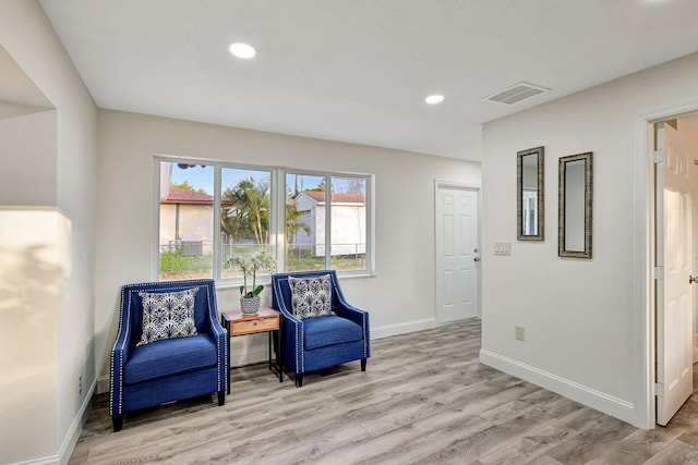 sitting room with light wood-type flooring