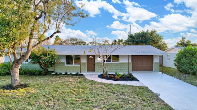 single story home with a front yard and a garage