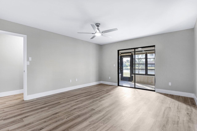 unfurnished room featuring light wood-type flooring and ceiling fan