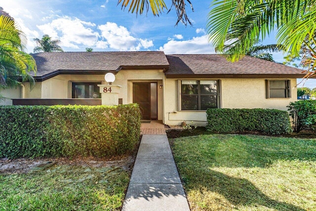 view of front of home with a front yard