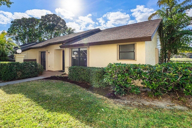 ranch-style home with a front yard