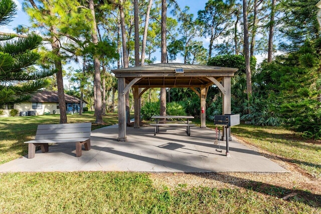 view of property's community with a gazebo, a yard, and a patio