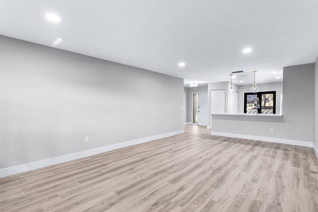 unfurnished living room featuring light hardwood / wood-style flooring