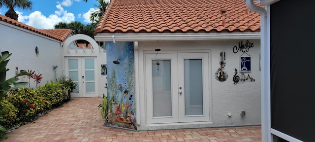 property entrance featuring french doors