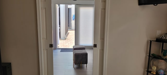 hallway featuring light tile patterned flooring