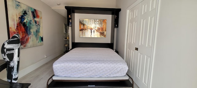 bedroom with light hardwood / wood-style floors