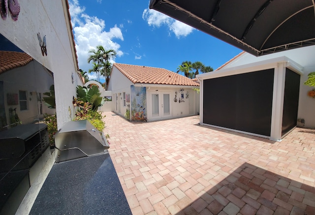 view of patio / terrace featuring french doors and area for grilling