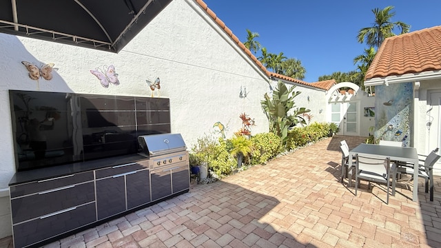 view of patio featuring grilling area and an outdoor kitchen