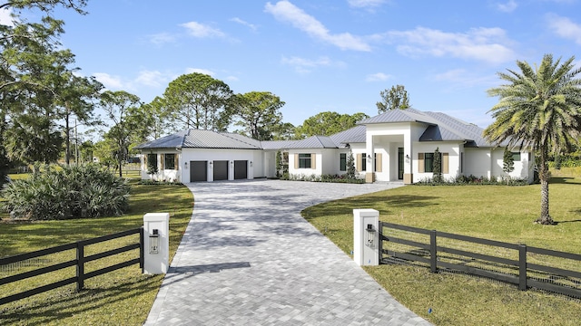 view of front facade featuring a garage and a front yard