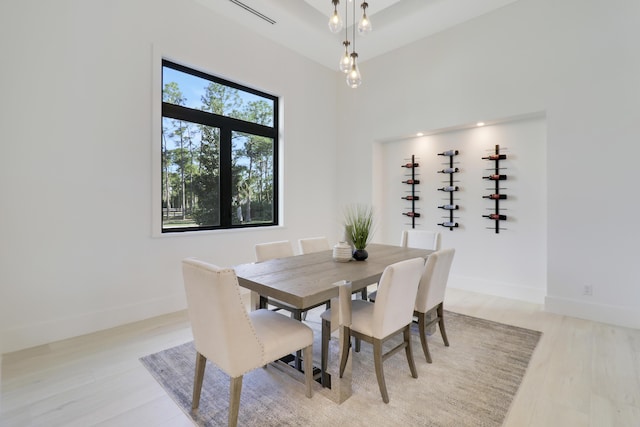 dining space with light hardwood / wood-style floors