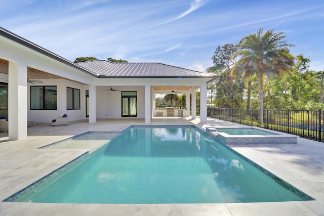 view of pool with an in ground hot tub, ceiling fan, and a patio area