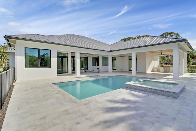 view of pool featuring an in ground hot tub, area for grilling, ceiling fan, and a patio