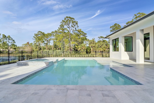 view of pool featuring an in ground hot tub and a patio area