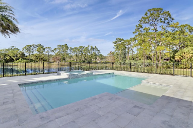 view of pool with a water view, an in ground hot tub, and a patio area