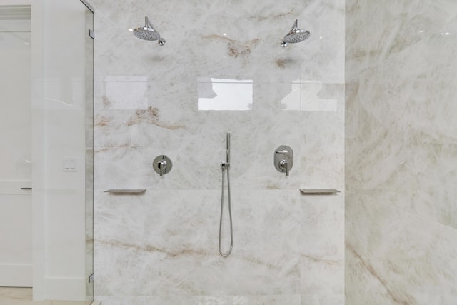 bathroom with a tile shower