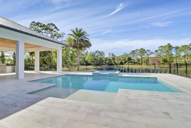 view of pool featuring an in ground hot tub and a patio area