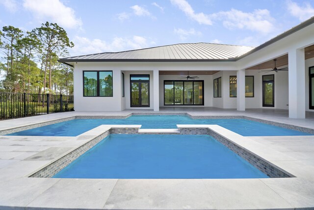 view of pool with ceiling fan, a patio, and an in ground hot tub