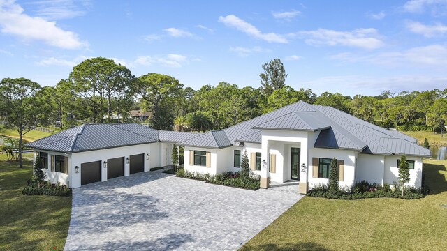 modern farmhouse with a garage and a front lawn