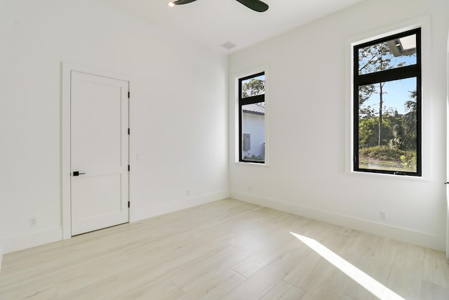 unfurnished room featuring ceiling fan and light hardwood / wood-style flooring