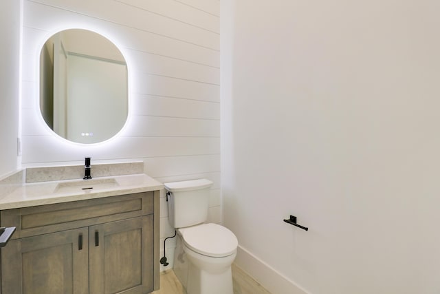 bathroom with toilet and vanity