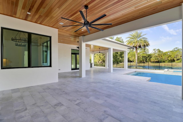 view of pool featuring ceiling fan and a patio