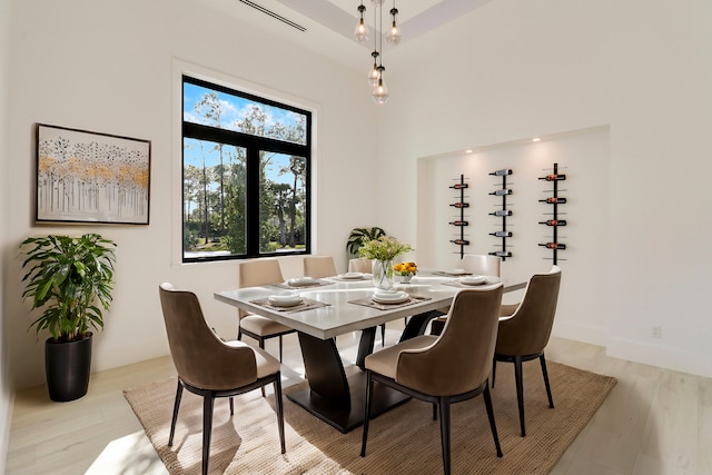 dining space with light hardwood / wood-style floors