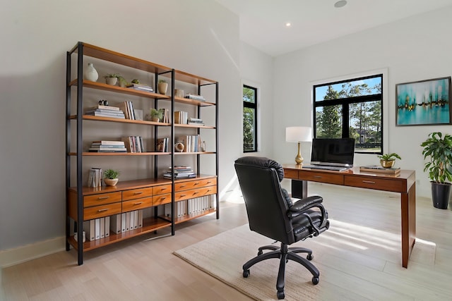 home office featuring light hardwood / wood-style floors