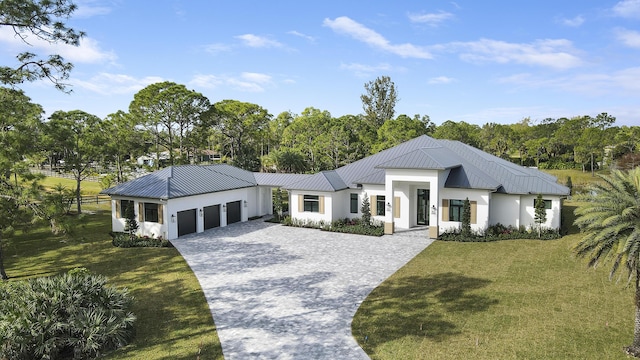 modern inspired farmhouse with a garage and a front yard