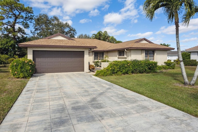 ranch-style home with a garage and a front yard