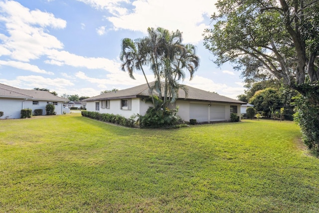 view of yard with a garage