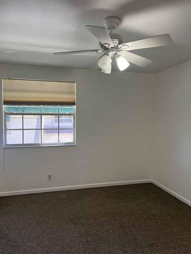 unfurnished room featuring a wealth of natural light, carpet floors, and ceiling fan