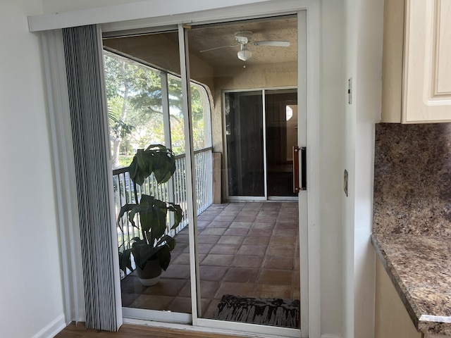 doorway to outside with ceiling fan