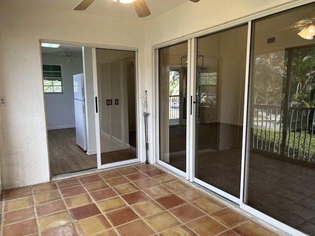 unfurnished sunroom featuring a wealth of natural light