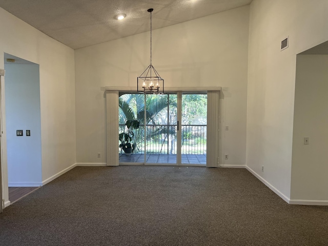 carpeted spare room with a chandelier and high vaulted ceiling